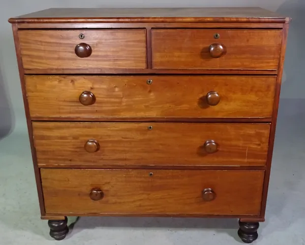 A Victorian mahogany chest of two short and three long drawers on turned tapering supports.