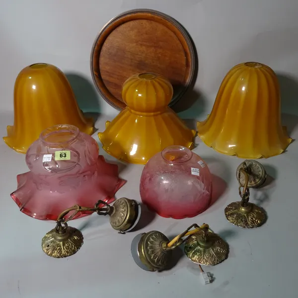 Two cranberry glass ceiling lights, three yellow glass shades, a circular mahogany tray and a sewing machine, (7).