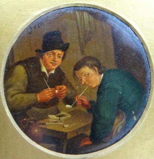 Manner of Adriaen van Ostade, Men smoking pipes in a tavern, oil on board, tondo, bears a signature, 8cm diam.
