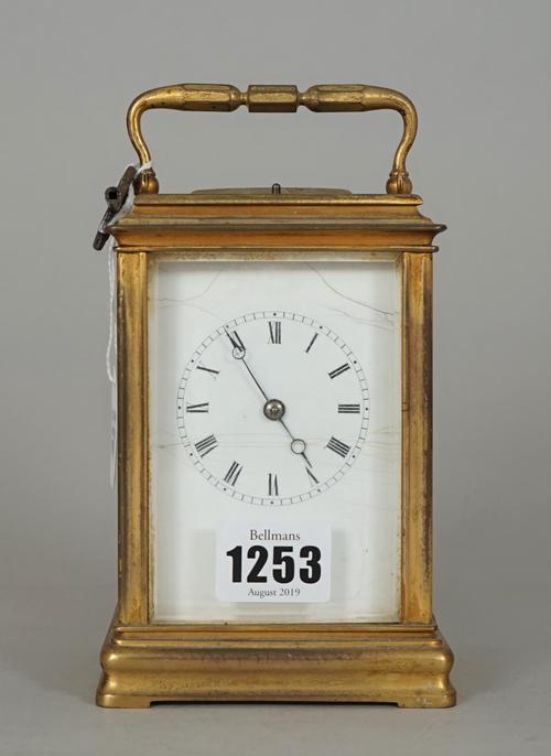 A brass cased carriage clock, early 20th century, with plain enamel dial, push repeat and two train movement, 14cm high, (key).