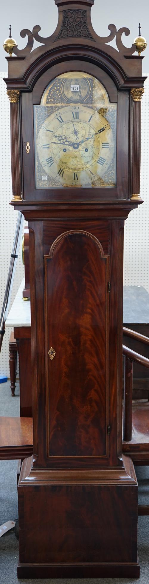 A George III mahogany longcase clock by Edmund Starr Norwich, the arch hood enclosing a brass engraved dial with subsidiary seconds dial over a waiste