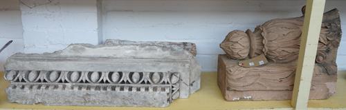 A 19th century stone door surmount or overmantel with carved dentil cornice decoration, 84cm wide, a stone corbel with carved cornucopia and traces of