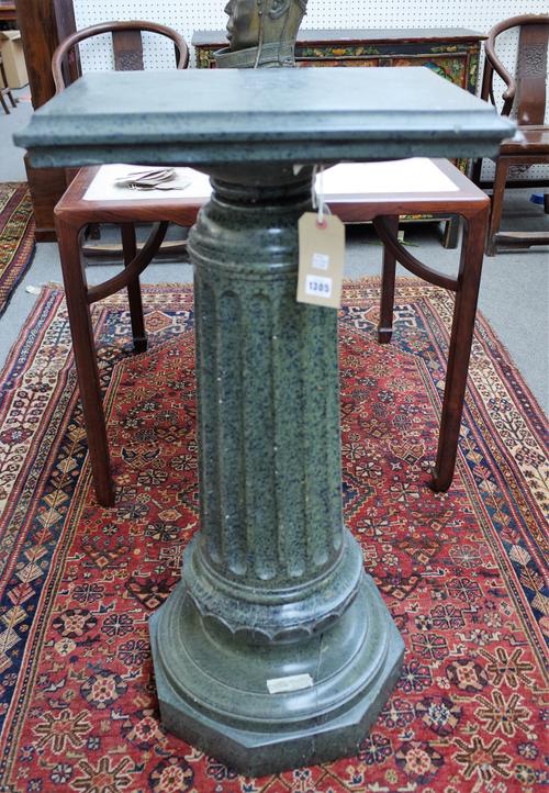 An Italian green vein marble stand, 19th century with a rectangular top, fluted, tapering circular column and an octagonal foot, 105cm high.