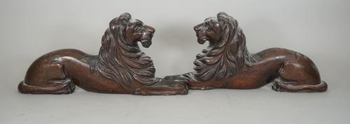 A pair of French carved oak flatback lions, 17th century style, probably 19th century, with mounting holes to base, 51cm wide, (2).