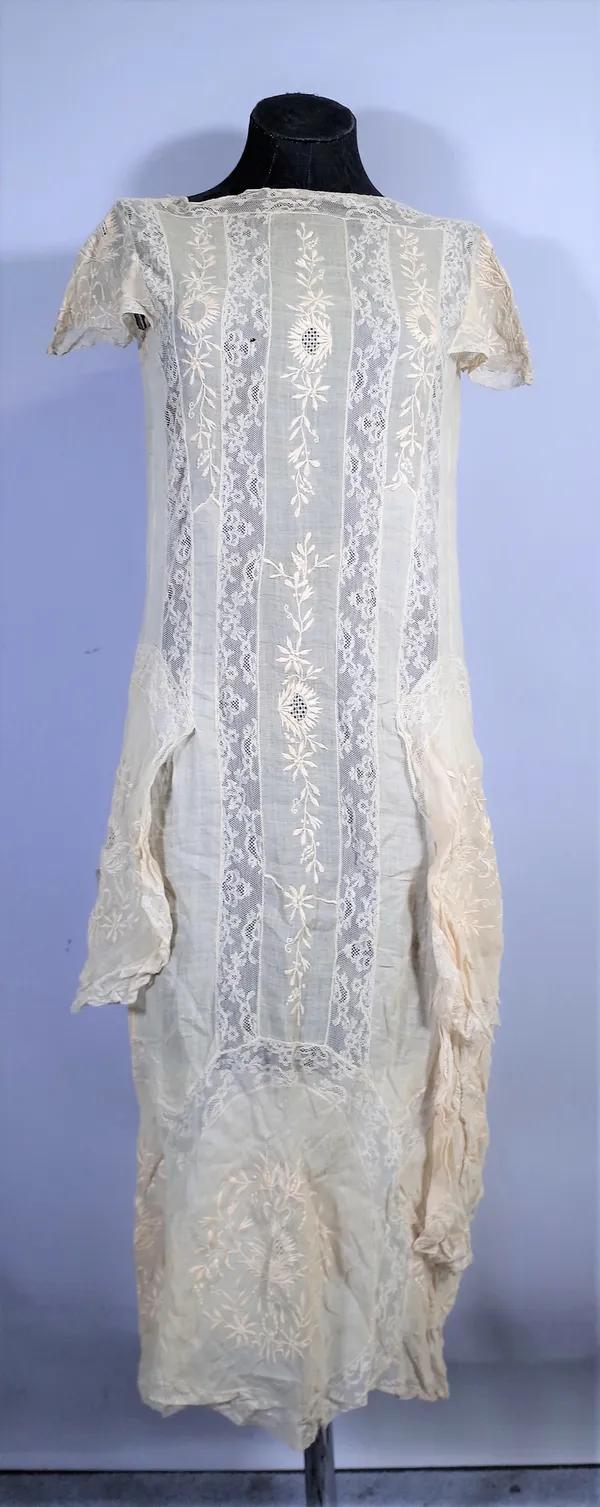 A 19th century cotton and lace dress with under slip and later corsets, (qty).