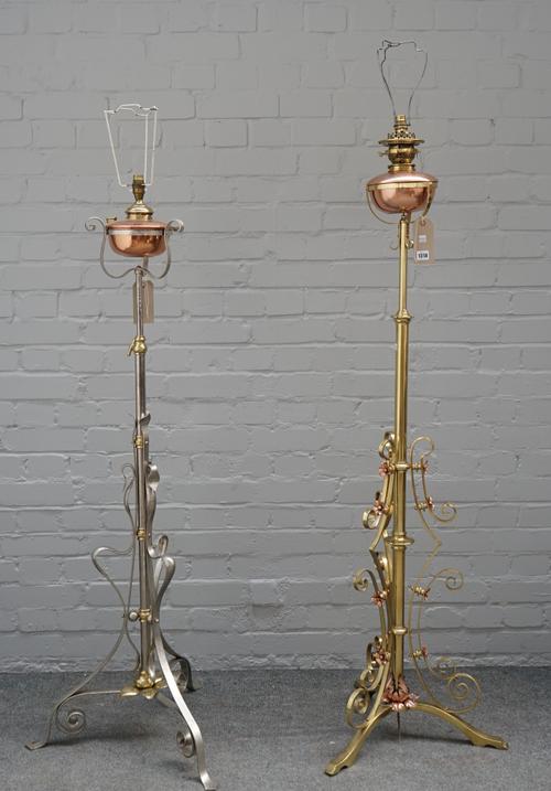 A W.A.S. Benson style brass and copper mounted adjustable oil lamp (converted), with Messenger oil burner and scroll work body and another similar, (2
