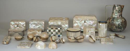 A quantity of Victorian mother-of-pearl decorated items, including caskets, visiting card cases, travelling inkwells, a water jug, a hand mirror, ciga