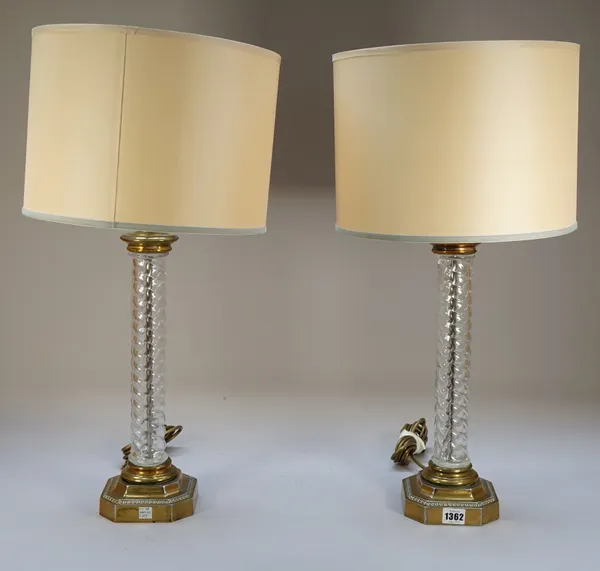 A pair of modern glass and gilt metal table lamps, each of barley-twist form on a canted square foot, 40cm high, (2).