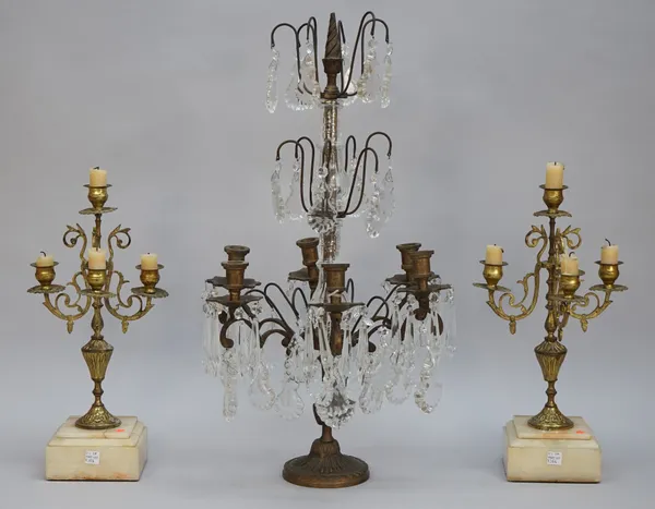 A modern six light centrepiece candelabra, gilt metal and glass on a fluted circular foot, 60cm high, and a pair of French gilt metal four light garni