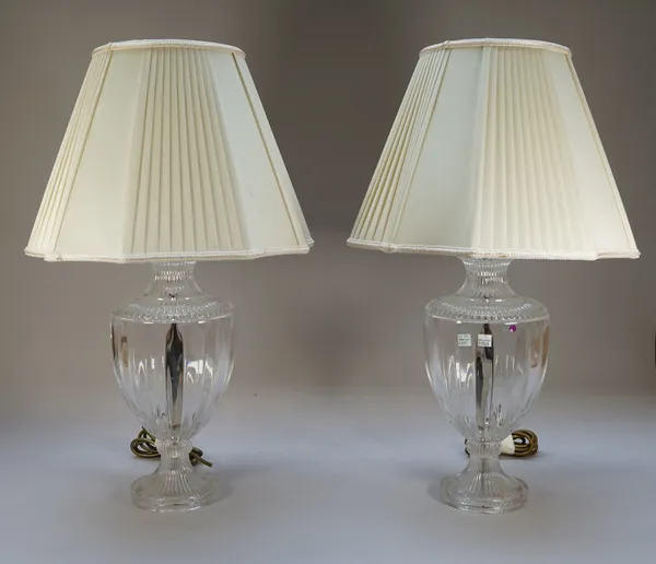 A pair of modern glass table lamps each of fluted baluster form with cream silk shades, lamps 38cm high, (2).