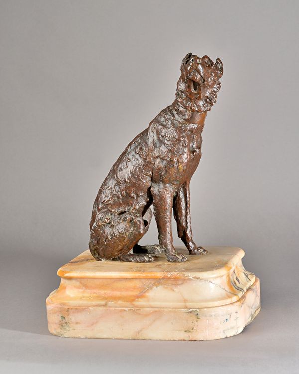 A patinated bronze model of a seated dog, circa 1900, raised on a stepped alabaster base, 43cm high overall.  Illustrated.