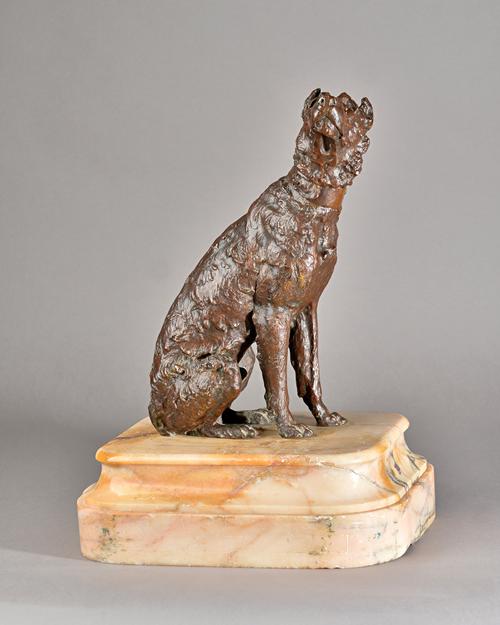 A patinated bronze model of a seated dog, circa 1900, raised on a stepped alabaster base, 43cm high overall.  Illustrated.