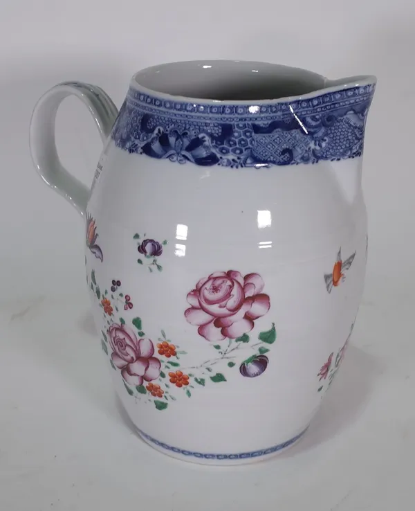 A Chinese export famille-rose barrel-shaped jug, Qianlong, painted with two birds and scattered flowers between underglaze-blue borders, 23cm high.