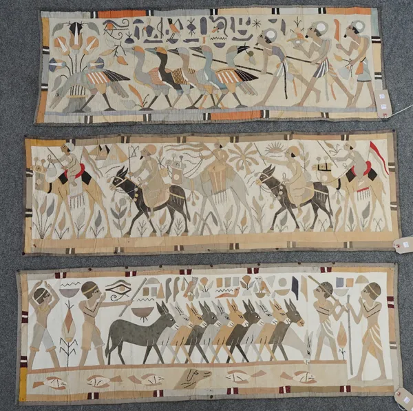 Three decoupage textile panels, each depicting ancient Egyptian scenes within a grey border, 132cm x 44cm, (3).