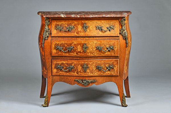 A Louis XV style commode, the serpentine marble top over a gilt metal mounted, floral marquetry inlaid Kingwood three drawer base, 96cm wide x 90cm hi