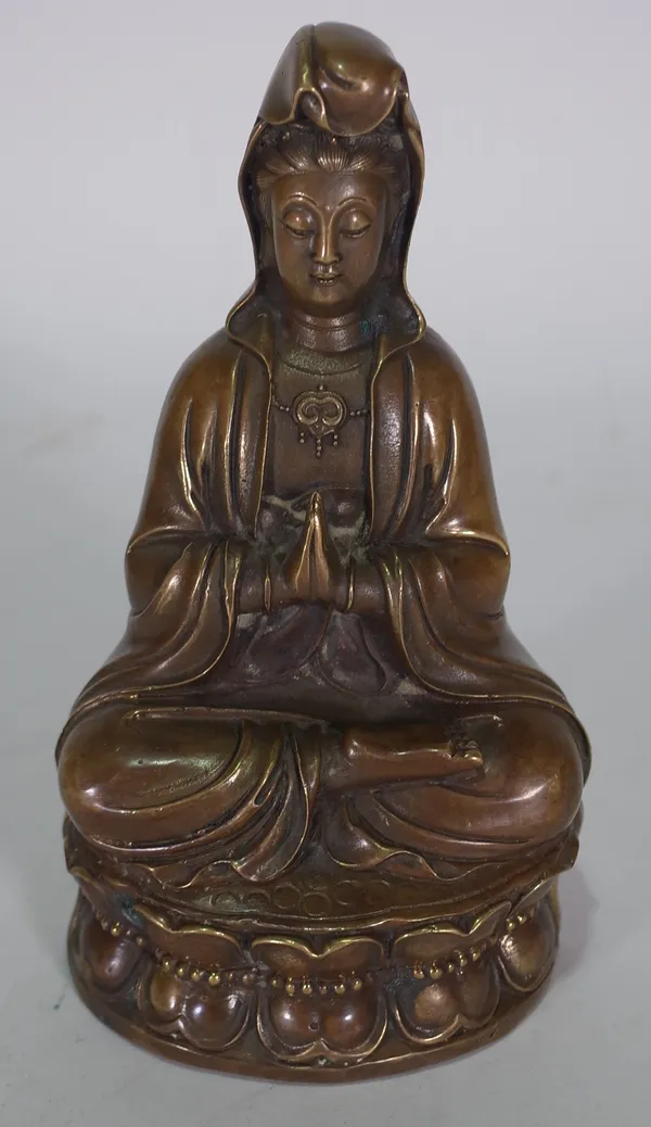 A Chinese bronze figure of Guanyin, 19th century, seated in dhyanasana on a double lotus base, 19.5cm.high.