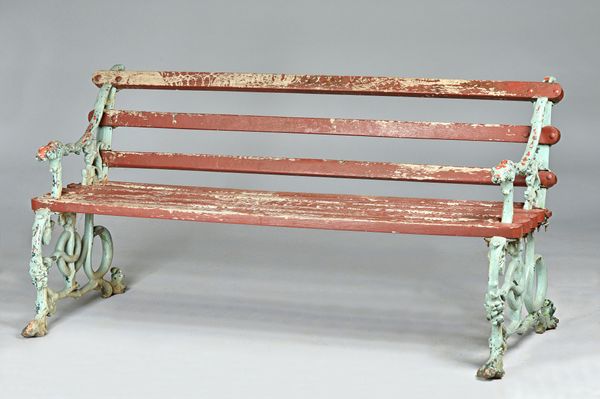 Coalbrookdale; a Victorian green painted cast iron bench with serpent and hound head mounts, 160cm wide x 78cm high.Illustrated.