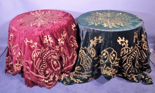 An early 20th century red velvet and gold thread embroidered table cloth and another in green, (2). Provenance; property from the late Sir David TangT