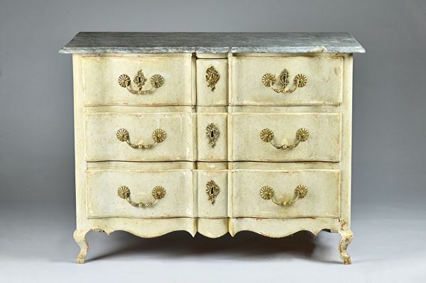 An 18th century continental commode, the shaped marble top over a later painted base of two short and two long drawers on squat scoll feet, 125cm wide