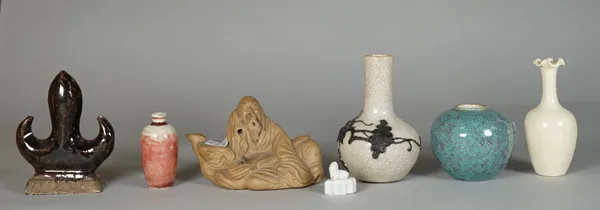 A group of Chinese ceramics, mostly 19th/20th century, comprising; a stoneware water dropper in the form of a recumbent man leaning against a rock, 10