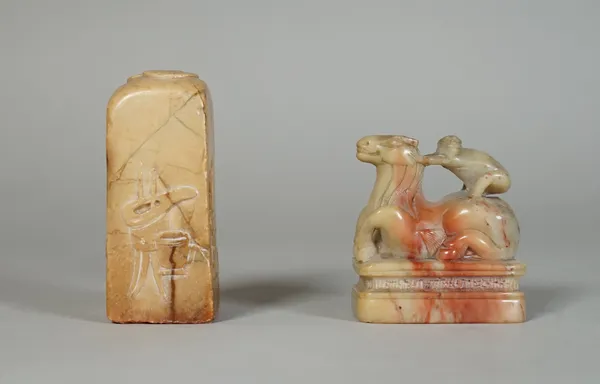 A Chinese soapstone seal, 19th century, of square section, the sides carved with a censer, a brushpot and jue vessel, the top carved with two overlapp