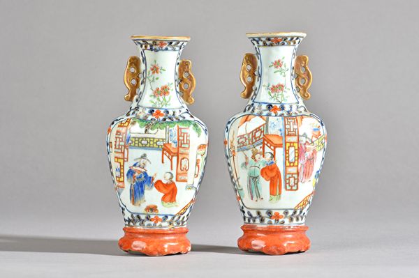 A pair of Chinese famille-rose wall vases, late 18th/19th century, of two-handled baluster form, painted with scenes from the `Romance of the Three Ki