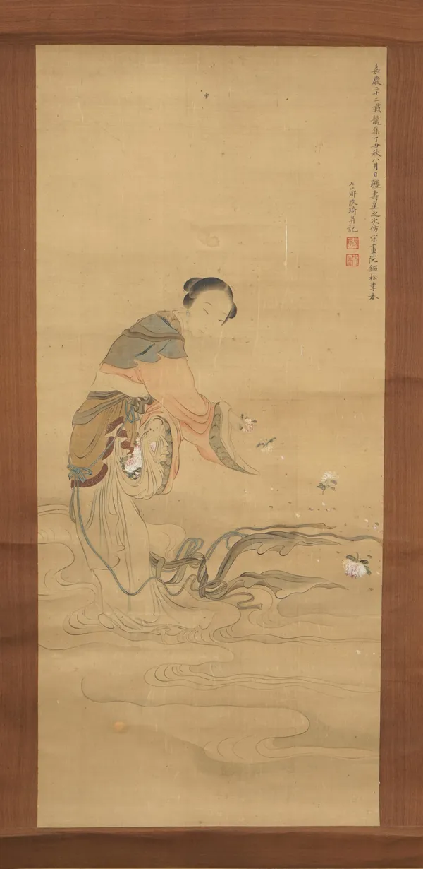 A Chinese watercolour on silk, late 19th century, painted with a young woman carrying flowers79cm. by 37cm,