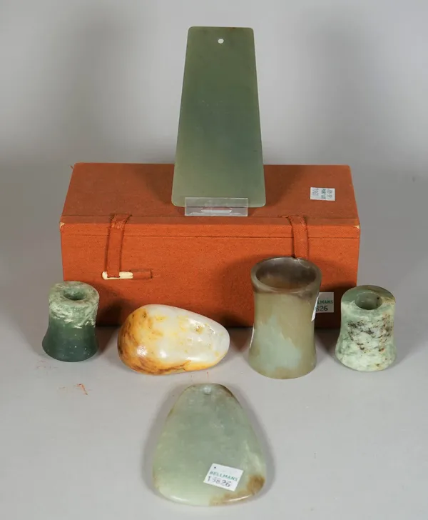 A group of Chinese jades, various dates, comprising; a green jade axe blade, Shang dynasty or later, 13cm. high. boxed; a celadon jade pendant/axe bla