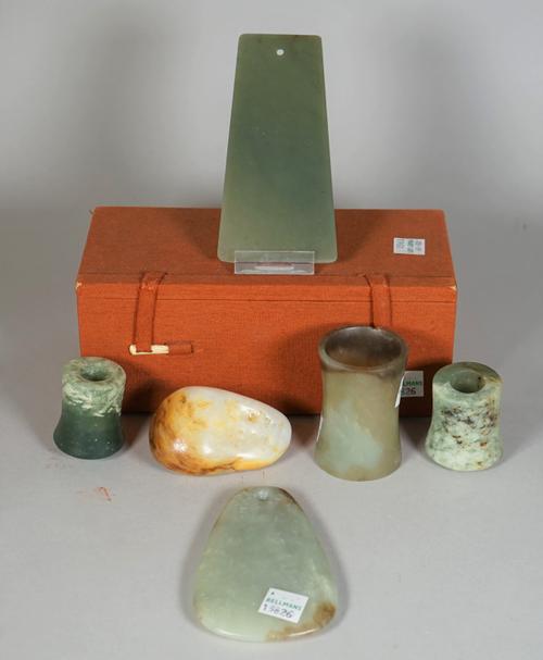 A group of Chinese jades, various dates, comprising; a green jade axe blade, Shang dynasty or later, 13cm. high. boxed; a celadon jade pendant/axe bla