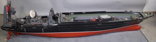 A large scratch built remote control model of a naval ship, (a.f. multiple extensive losses) sold as seen and not working.