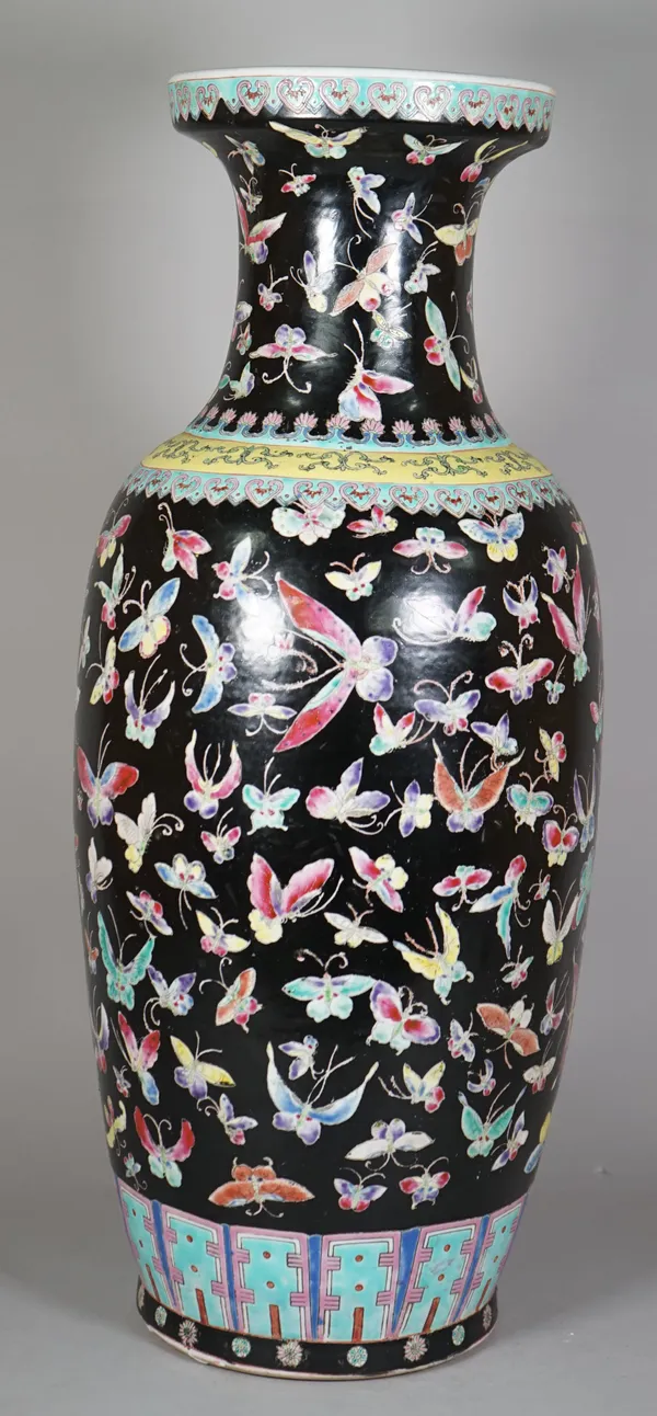 A Chinese famille-rose black-ground baluster vase, 20th century, printed and coloured  with insects beneath ruyi-head borders, (a.f), 62cm. high, adap