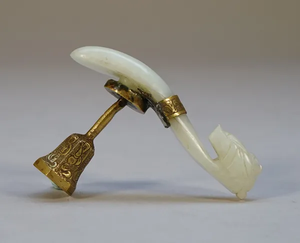 A Chinese jade belt hook, carved with dragon head terminal, the stone of vary pale green  tone,adapted as a seal handle with gilt-metal mounts, 9cm. l