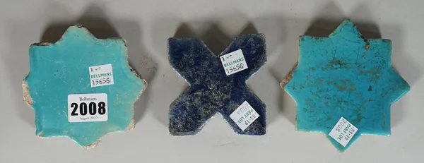 A Kashan turquoise glazed star tile, 12th/13th century, (a.f), 10cm. wide; another turquoise glazed star tile, possibly later, 10.5cm. wide; and a dee