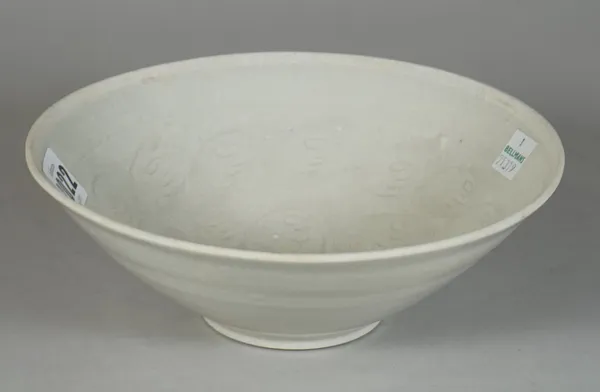 A Chinese qingbai-glazed bowl, probably Song dynasty, the interior incised with scrolls, 18.5cm. diameter.