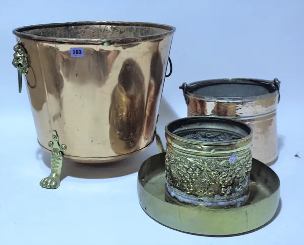 Copper wares & Brass comprising; a lion paw footed coal bucket, a pot with swing handle, a flower pot and a tray, (4).