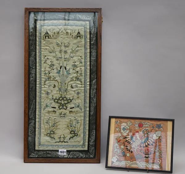 A Chinese embroidered rectangular sleeve panel, circa 1900, worked with birds amongst bamboo, flowers and insects, 52cm. by 20.5cm., mounted, framed a