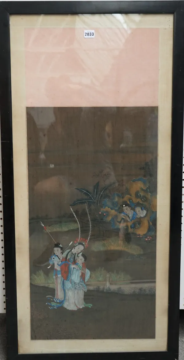 A Chinese painting on silk, probably 19th century, painted with two children spying on three figures behind pierced rocks, image 77cm. by 41cm., frame