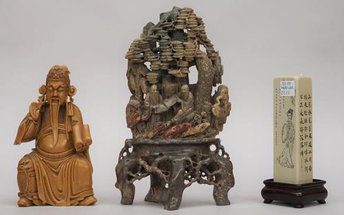 A Chinese soapstone carving, late 19th/20th century, carved with two scholars and two cranes beneath a pine tree, the base carved as tree roots,  22cm
