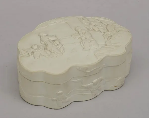 A Chinese white biscuit porcelain box and cover, Qianlong seal mark but later, of ruyi-head form, the cove rmoulded in relief with a family in a garde