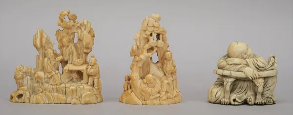 Two small Chinese ivory groups, 19th century, one carved as three figures around a table before rocks, 7.5cm. high, the second carved with two figures