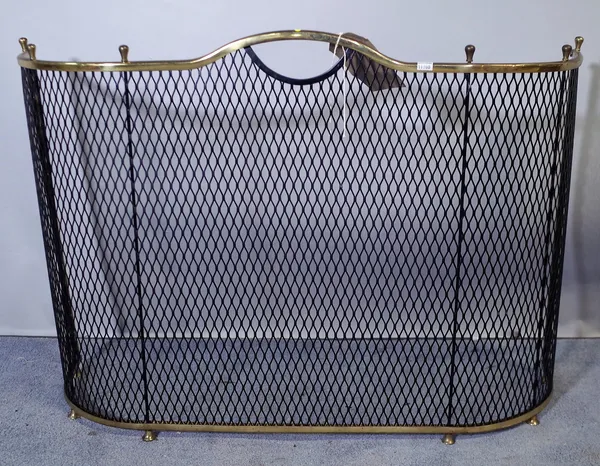 A Regency style serpentine brass fire guard, 80cm wide x 53cm high.