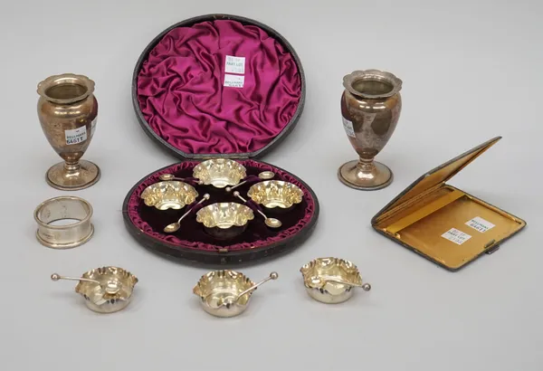 Silver, comprising; a set of four small shaped circular salts, with a set of four matching salt spoons, Birmingham 1887, cased, a set of three small s