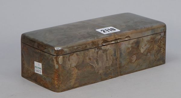 A late Victorian silver table cigarette box, the exterior plain, wooden lined within, length 21cm, Birmingham 1899. Illustrated.