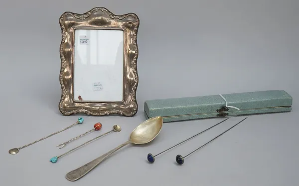 A pair of hat pins, having lapis lazuli finials, cased, a silver mounted shaped rectangular photograph frame (modern), a German tablespoon, detailed 8