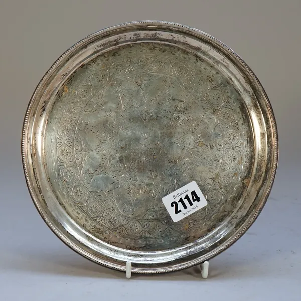 A Victorian silver salver, of circular form, with engraved decoration within a beaded rim, presentation inscribed, diameter 20.5cm, London 1892, weigh