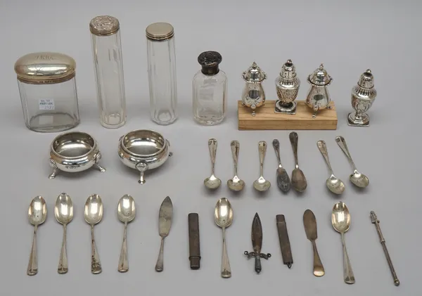 Silver and silver mounted wares, comprising; eleven rat tail pattern coffee spoons, mixed dates, two butter knives, a pair of circular salts, each rai