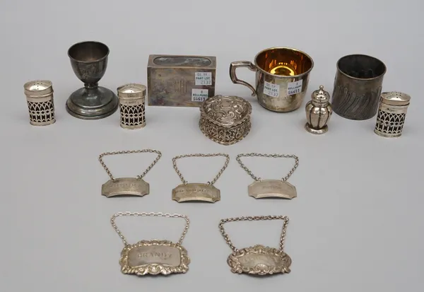 Silver, comprising; three oval pepperettes, with pierced decoration, Chester 1911, another pepperette, a heart shaped trinket box, with embossed decor