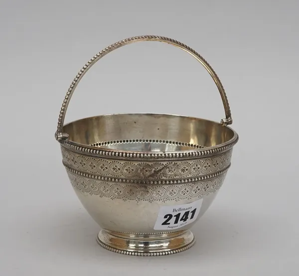 A Victorian silver sugar bowl, decorated to the handle and to the rims with beads, otherwise engraved with two bands, London 1868, weight 226 gms.