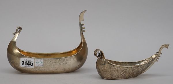 A silver vessel, modelled as a stylized Viking boat, length 18cm, London 1902 and another silver vessel, modelled as a stylized Viking boat, decorated