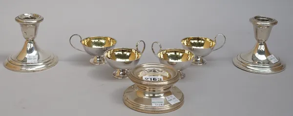 A silver stand of circular form (loaded), diameter 9.5cm, a pair of Gorham Sterling candlesticks, on circular bases (loaded) and a set of four Swedish